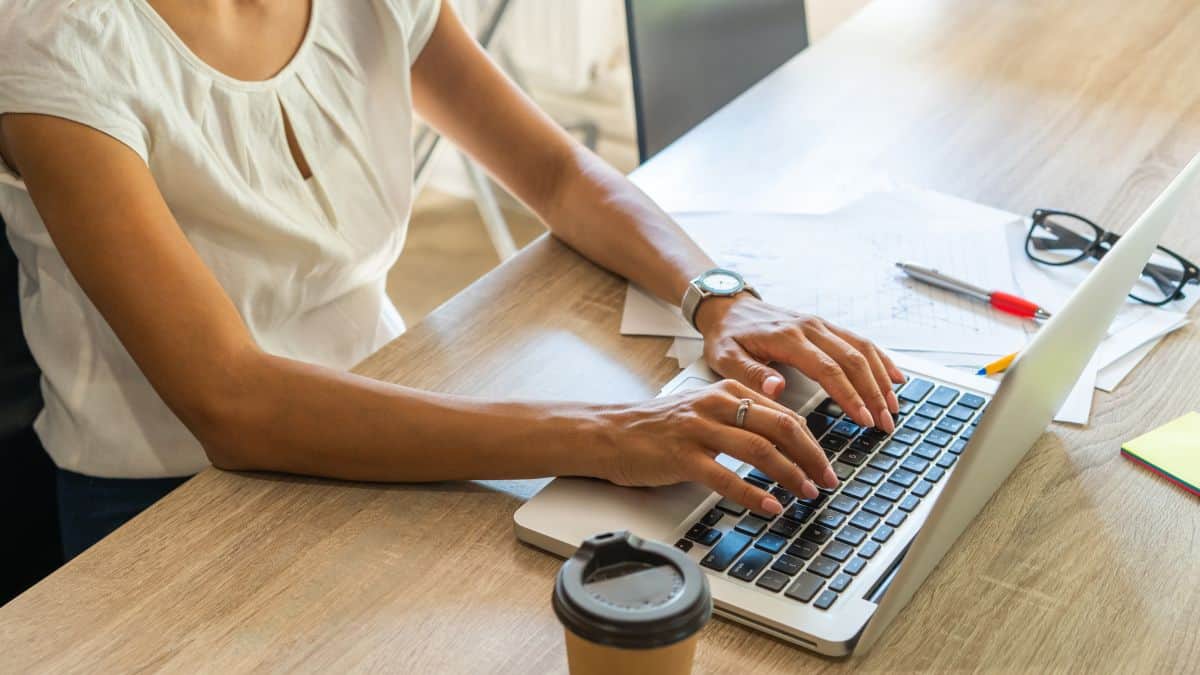 A photo of a woman working on her laptop